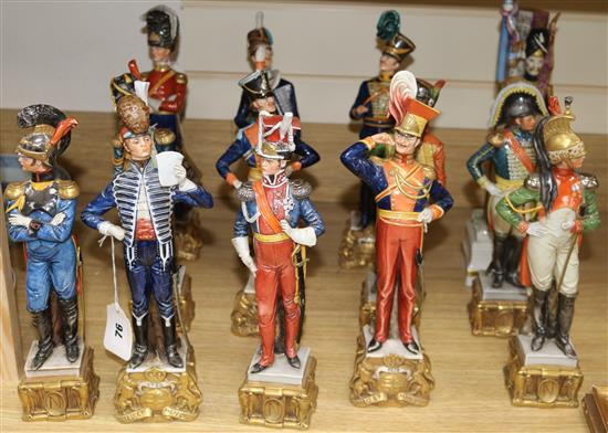 A set of twelve Capo di Monte Napoleonic Wars military figures and a figure of an Old Guard standard bearer tallest 38cm